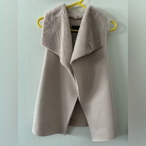 Faint pink small fur vest